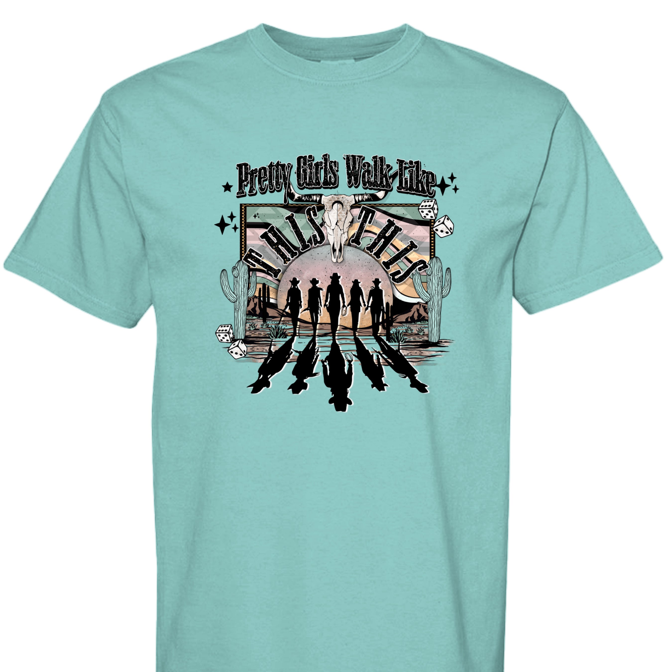CHALKY MINT - FRONT - Western graphic T-shirt design with cowgirl silhouettes, steer skull, desert sunset, dice, and text Pretty Girls Walk Like This.
