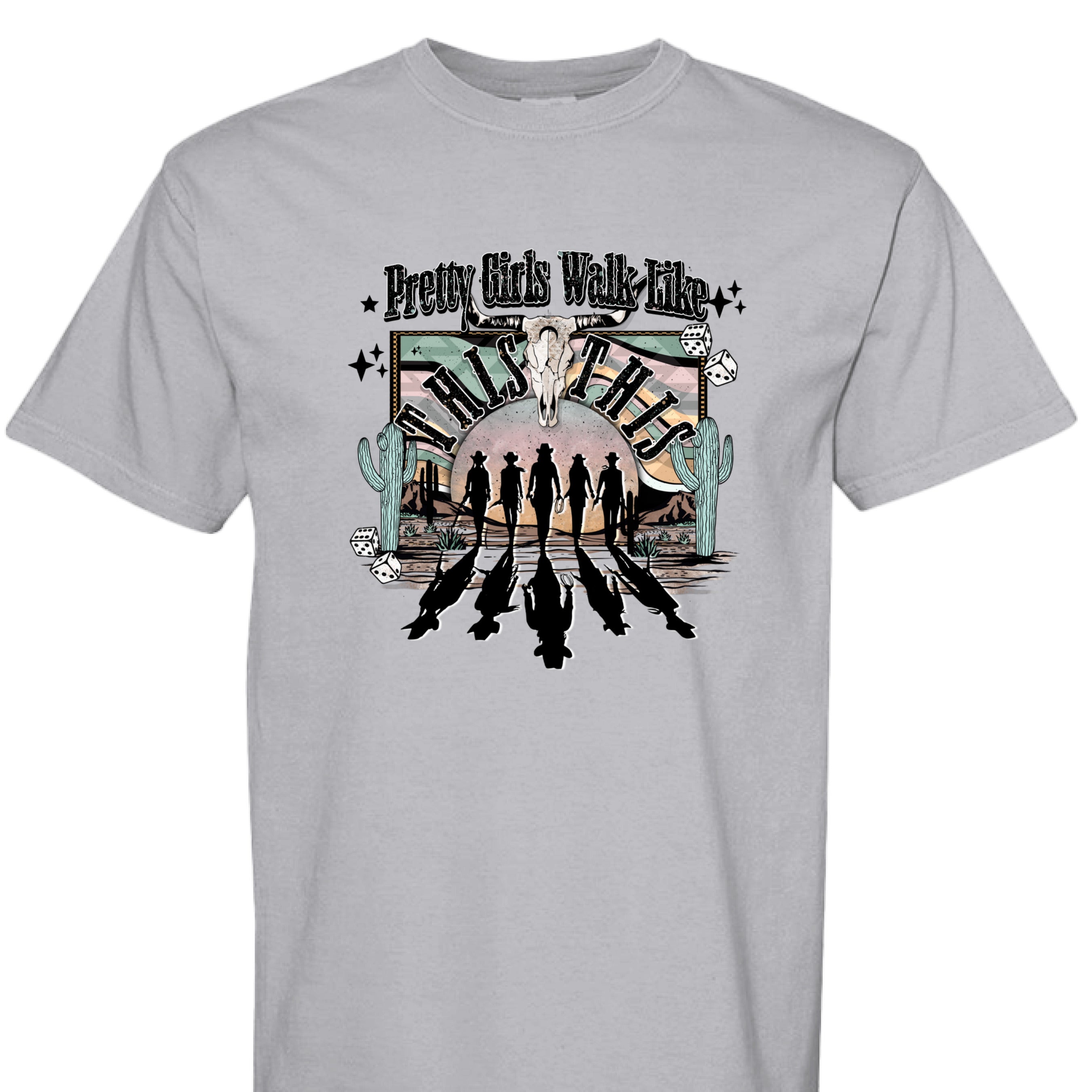 GRANITE - FRONT - Western graphic T-shirt design with cowgirl silhouettes, steer skull, desert sunset, dice, and text Pretty Girls Walk Like This.