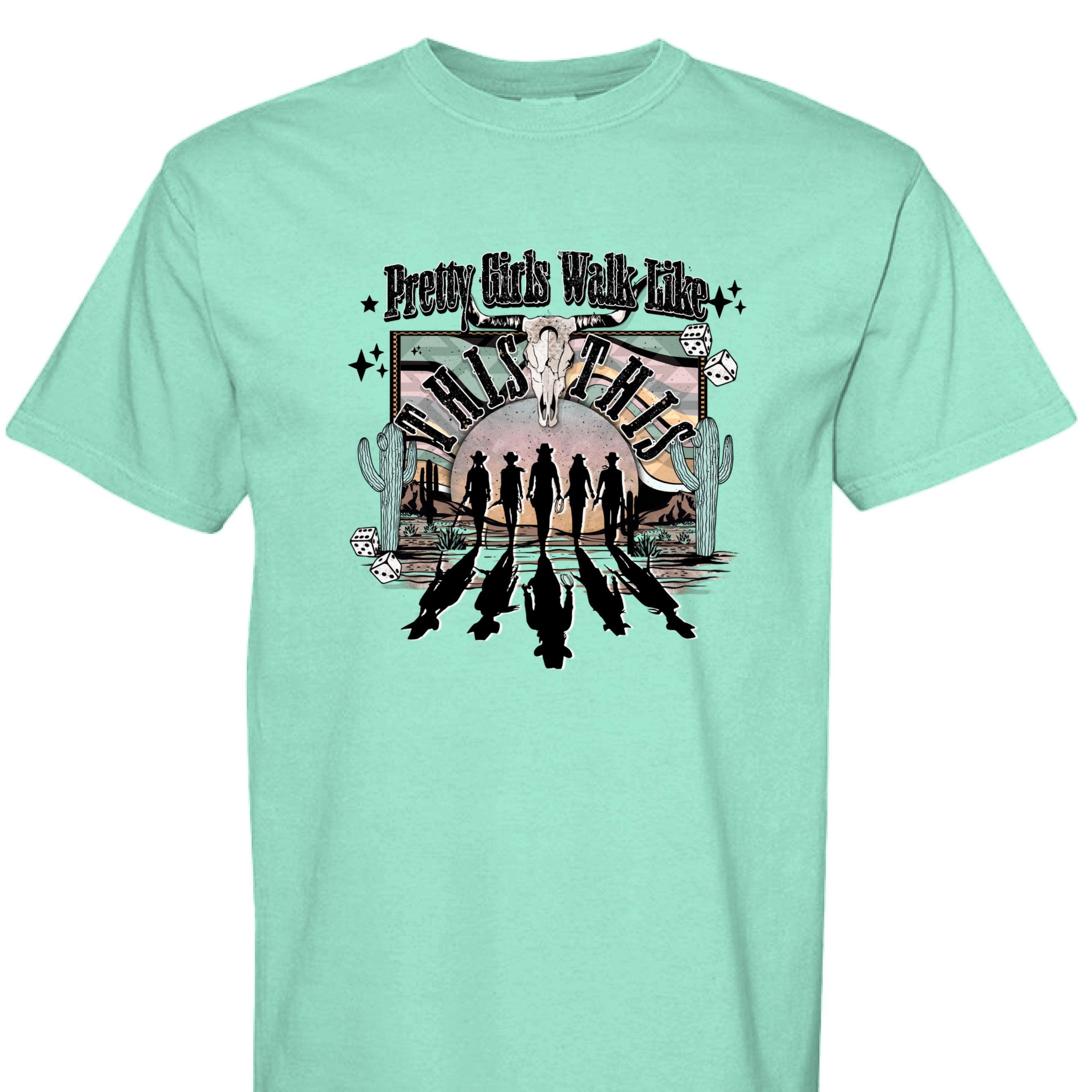 ISLAND REEF - FRONT - Western graphic T-shirt design with cowgirl silhouettes, steer skull, desert sunset, dice, and text Pretty Girls Walk Like This.