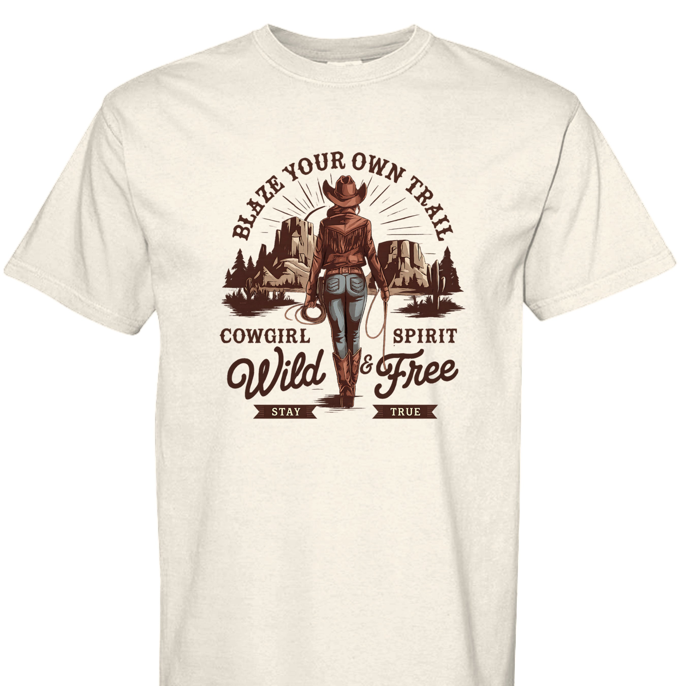 IVORY - FRONT - Cowgirl graphic shirt with rope border, desert mountains, and text Blaze Your Own Trail Wild & Free.