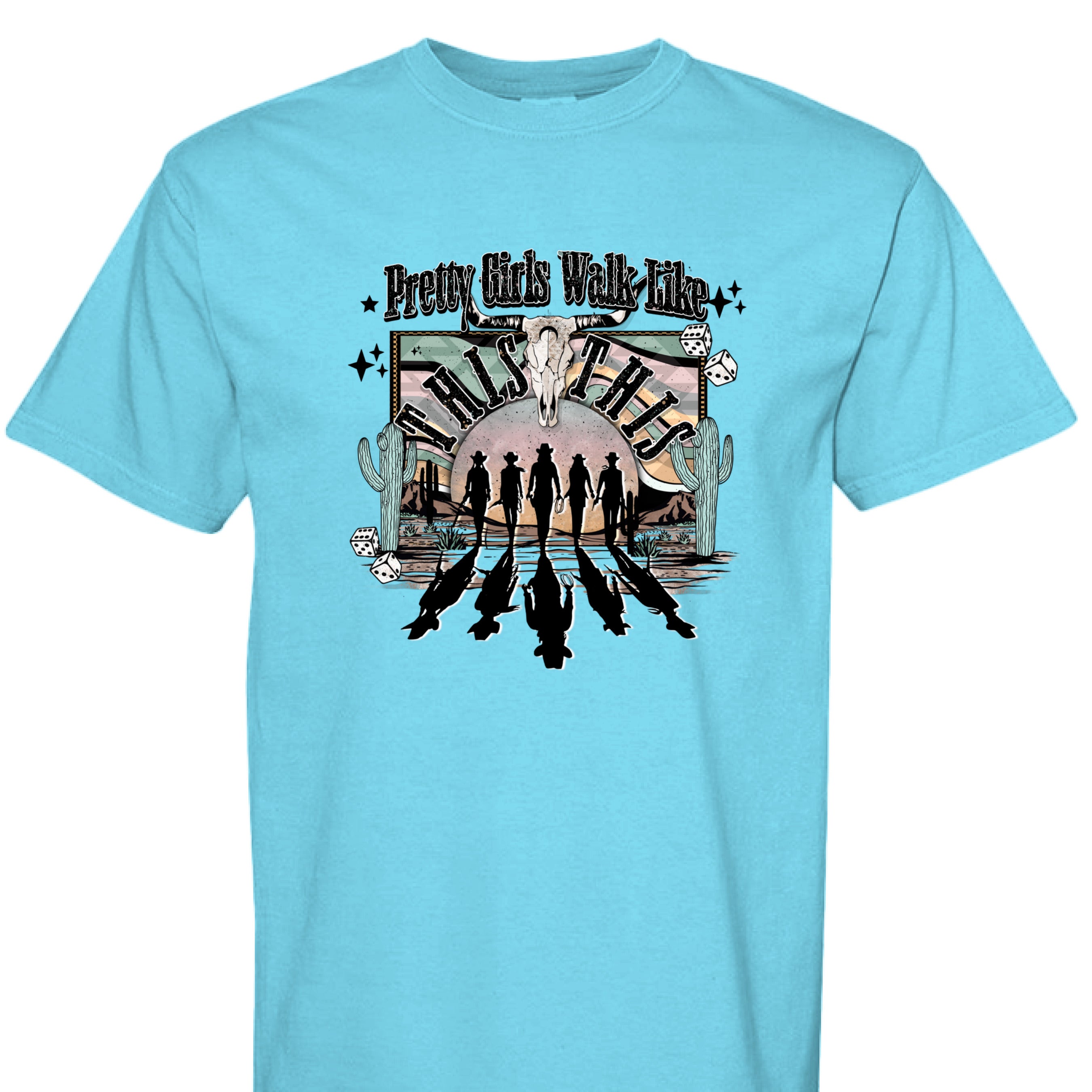 LAGOON BLUE - FRONT - Western graphic T-shirt design with cowgirl silhouettes, steer skull, desert sunset, dice, and text Pretty Girls Walk Like This.