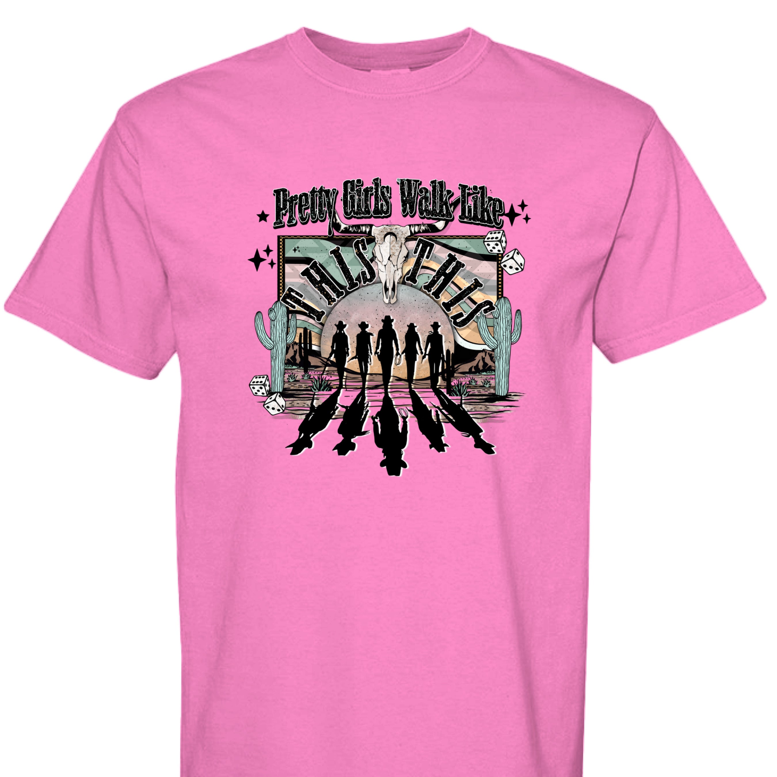 NEON PINK - FRONT - Western graphic T-shirt design with cowgirl silhouettes, steer skull, desert sunset, dice, and text Pretty Girls Walk Like This.