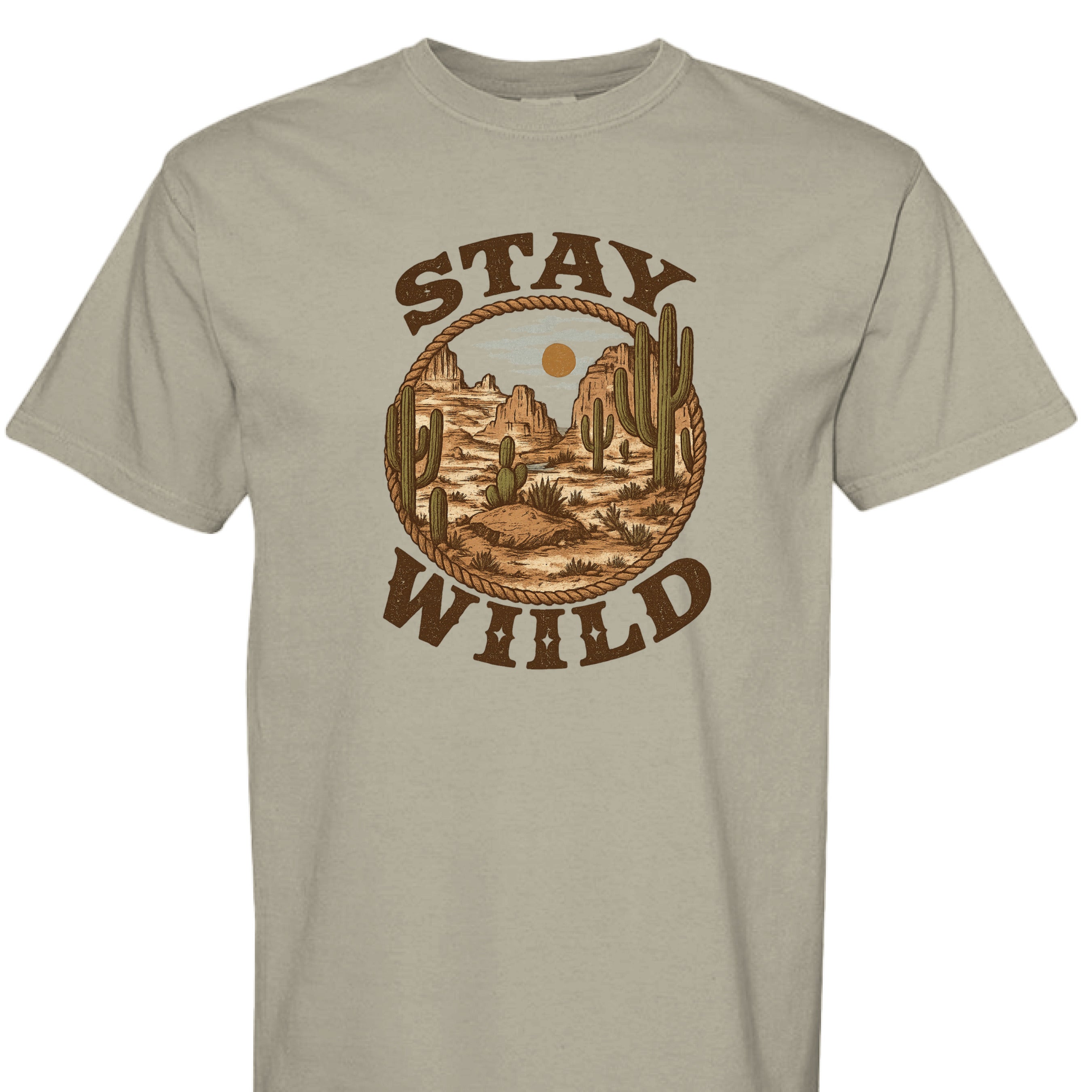 SANDSTONE - FRONT - Stay Wild western graphic tee with desert mountains, cacti, rope border, and bold rustic lettering.