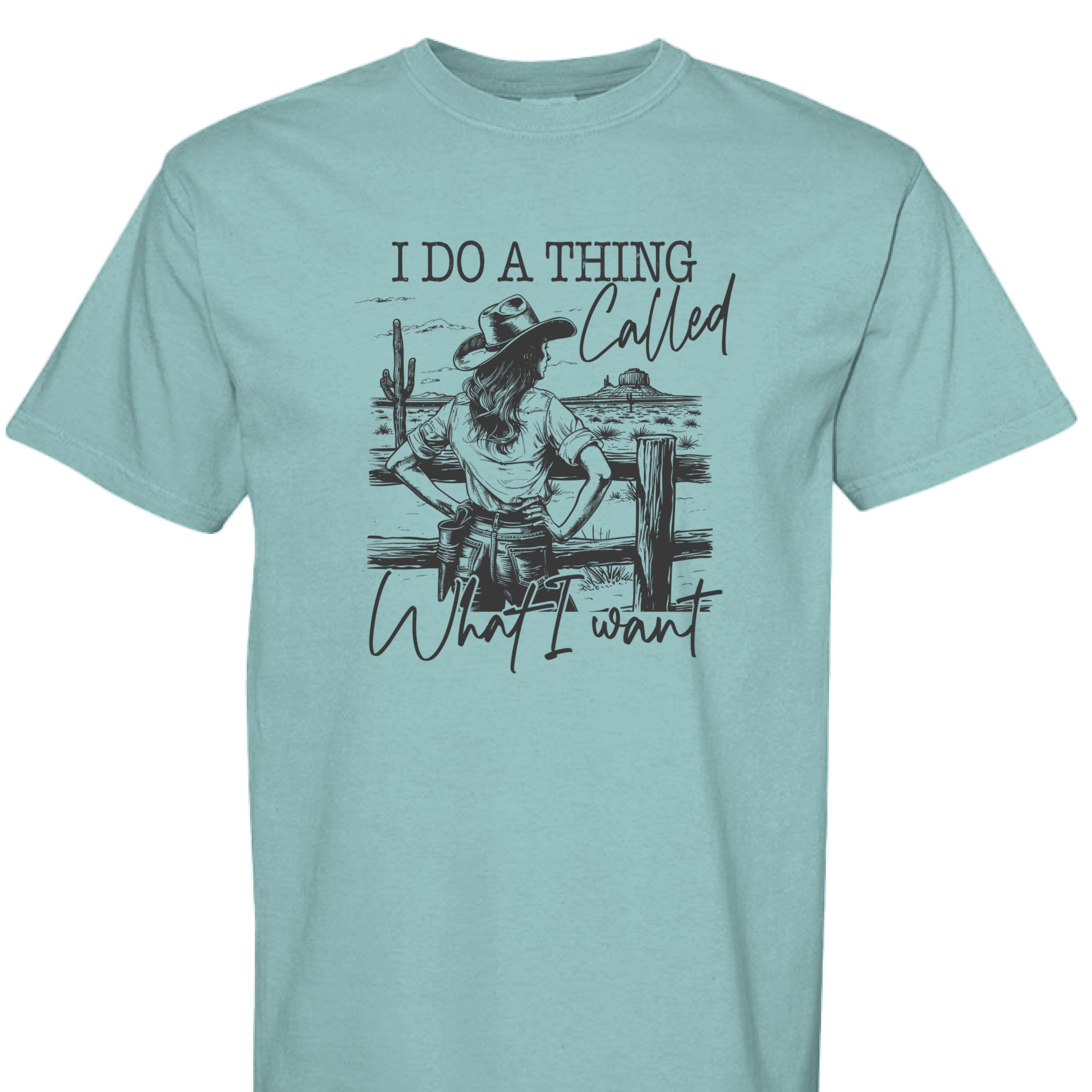SEAFOAM - FRONT - I Do a Thing Called What I Want western shirt with cowgirl in hat and boots leaning on fence in desert landscape.