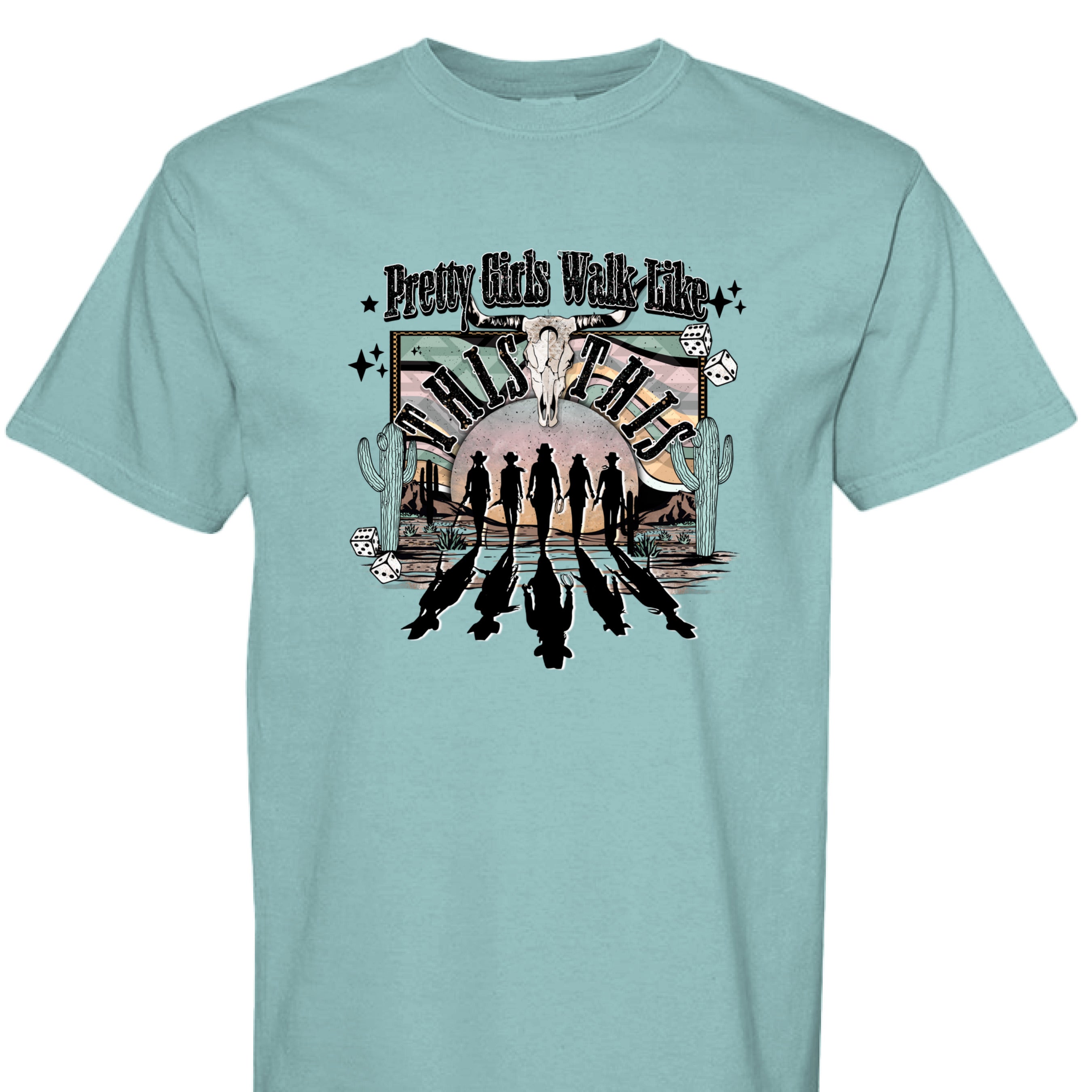 SEAFOAM - FRONT - Western graphic T-shirt design with cowgirl silhouettes, steer skull, desert sunset, dice, and text Pretty Girls Walk Like This.