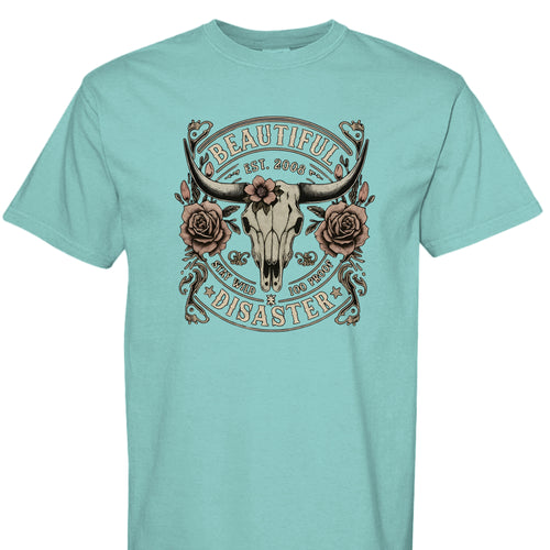CHALKY MINT - FRONT - Western graphic t-shirt featuring a longhorn skull with roses and text ‘Beautiful Disaster – Stay Wild 100 Proof.’ Vintage distressed design.