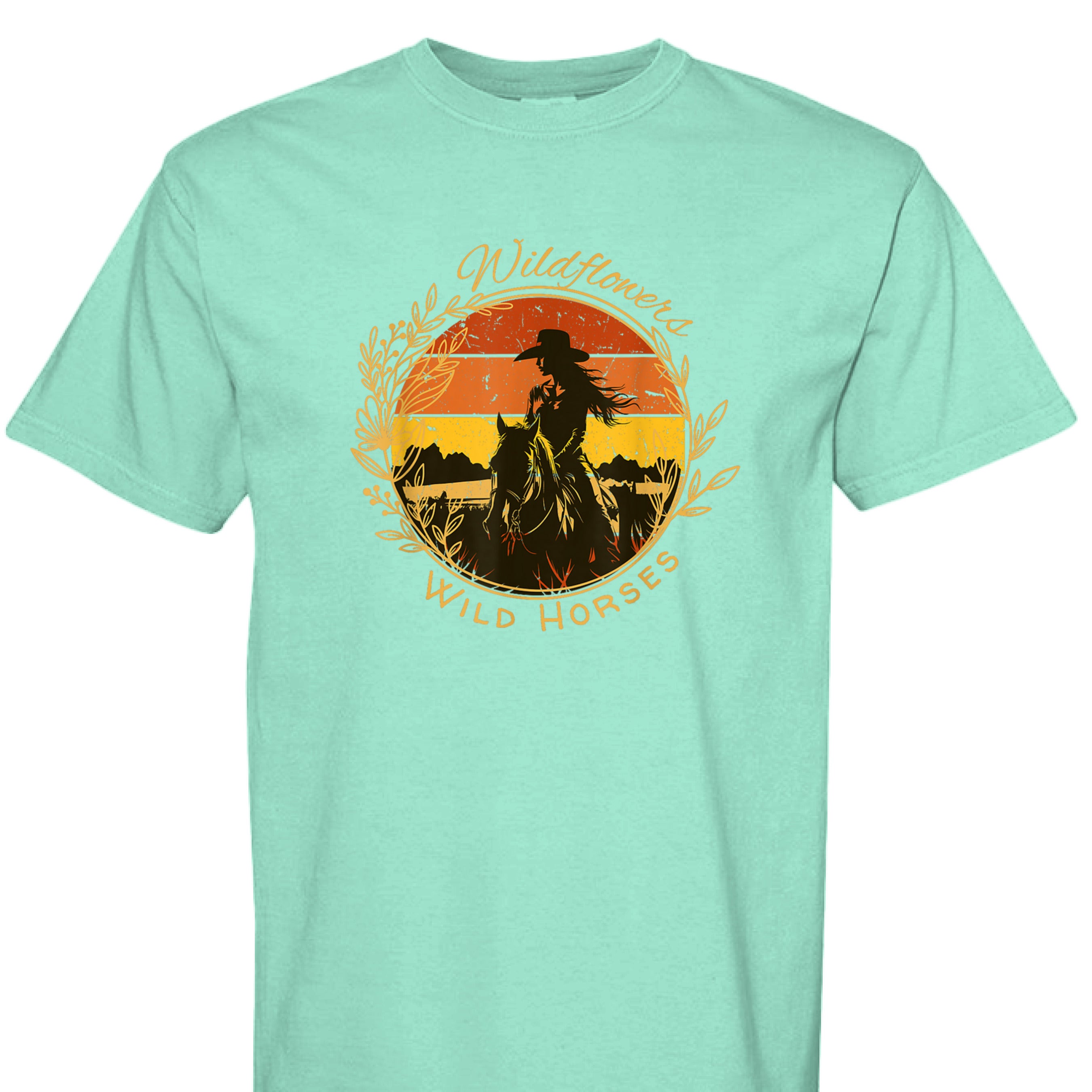 ISLAND REEF - FRONT - Wildflowers Wild Horses western shirt with cowgirl riding horse at sunset inside floral wreath graphic design.