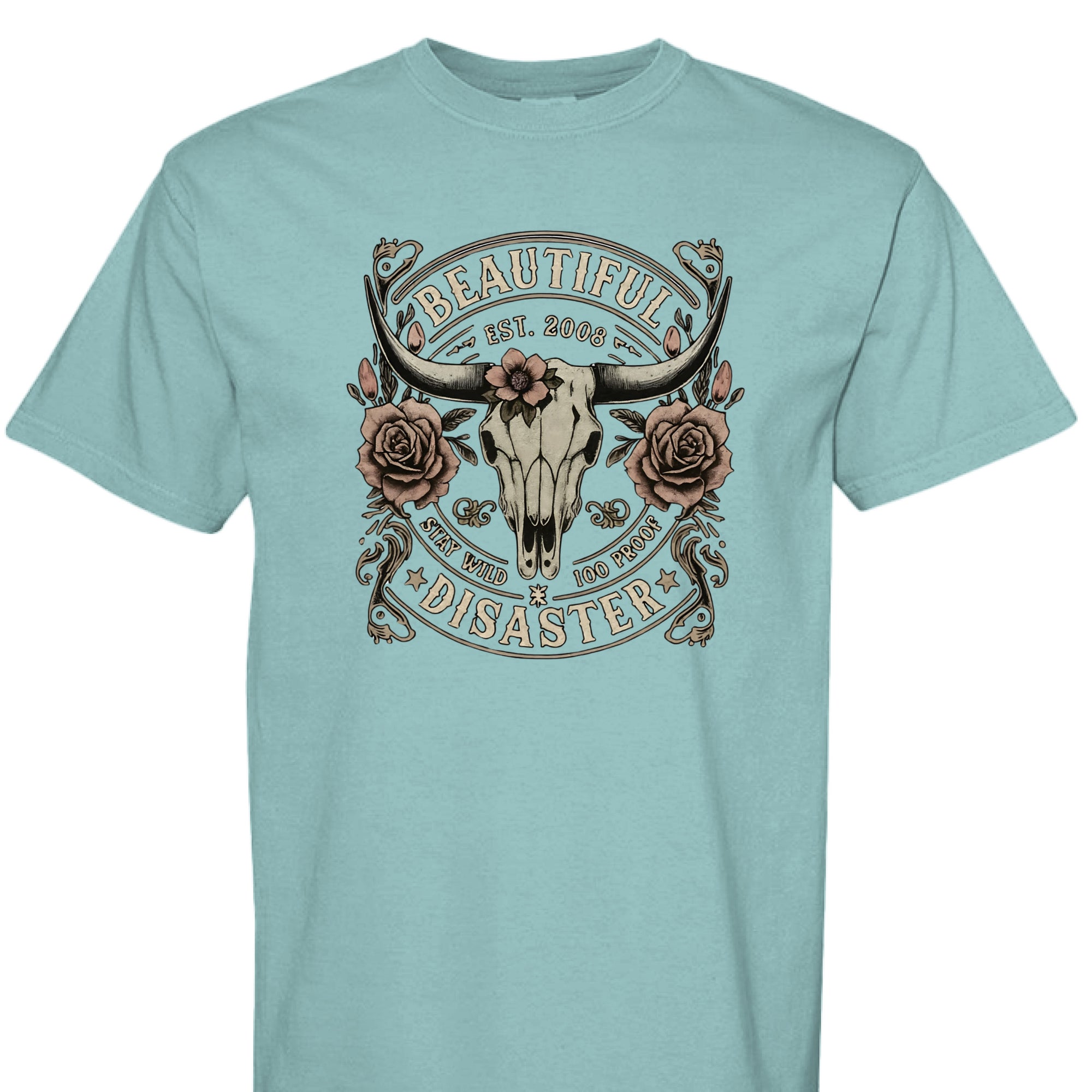 SEAFOAM - FRONT - Western graphic t-shirt featuring a longhorn skull with roses and text ‘Beautiful Disaster – Stay Wild 100 Proof.’ Vintage distressed design.