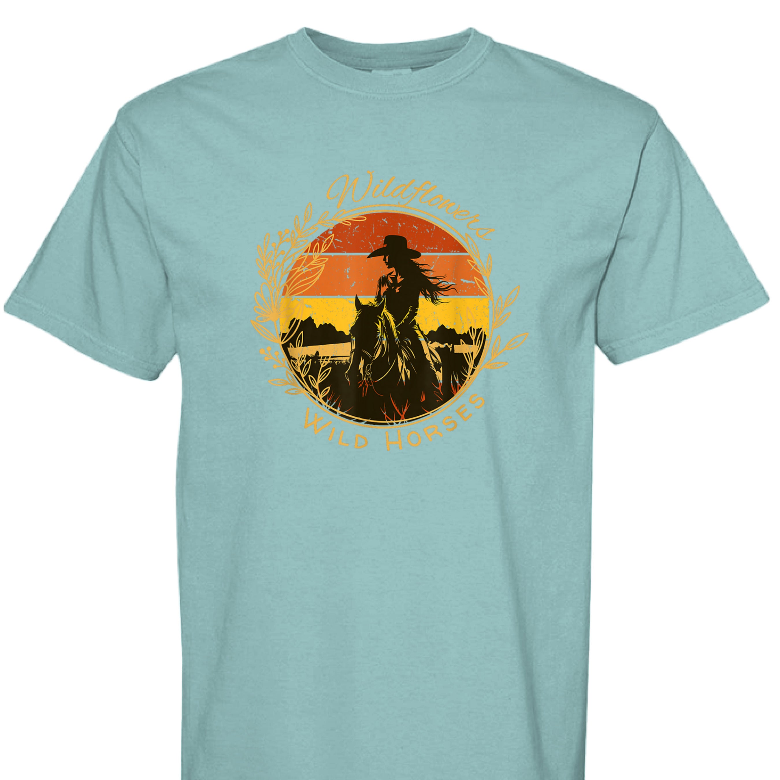 SEAFOAM - FRONT - Wildflowers Wild Horses western shirt with cowgirl riding horse at sunset inside floral wreath graphic design.