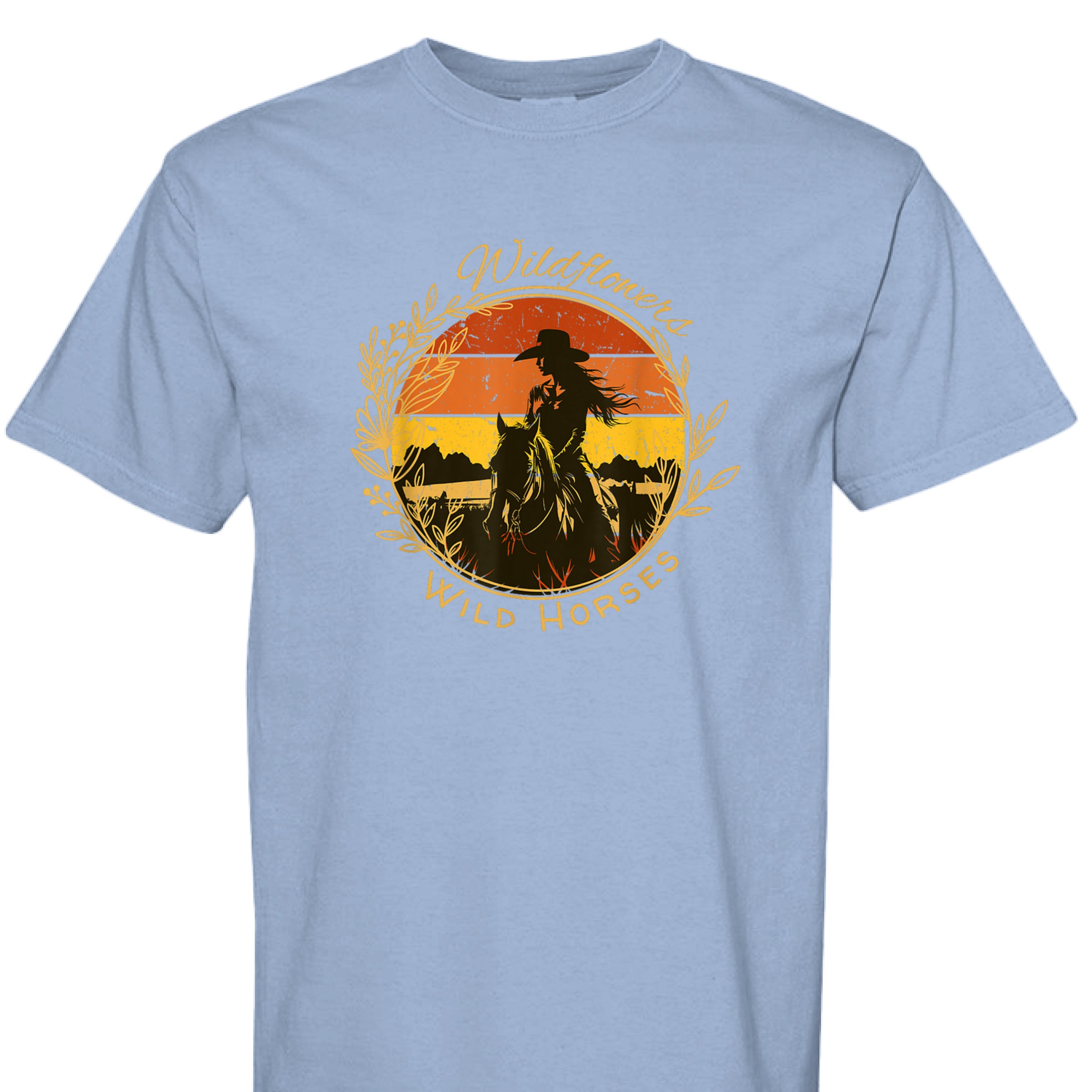 WASHED DENIM - FRONT - Wildflowers Wild Horses western shirt with cowgirl riding horse at sunset inside floral wreath graphic design.
